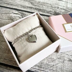 NEW! In box. Gorgeous stretchy beaded bracelet w/ puffy heart charm, silver tone